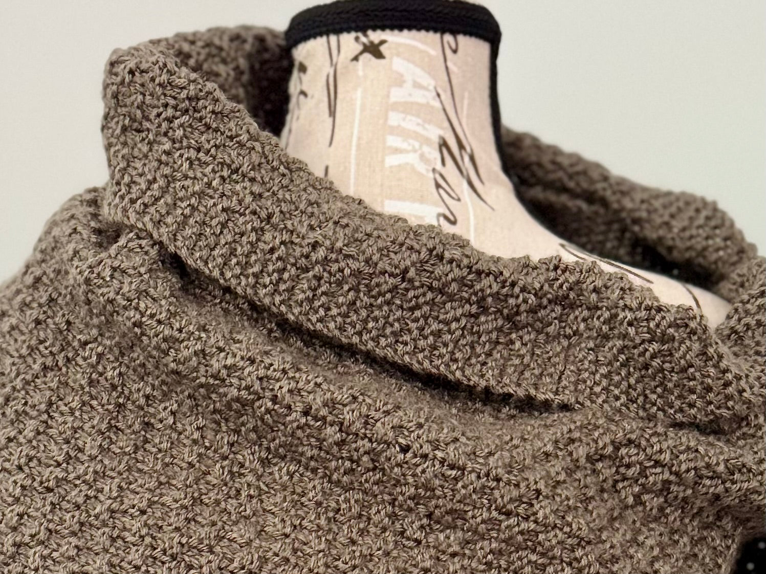 Hand knitted in double moss stitch this wrap envelopes like a hug and can be wrapped to your liking. Custom commission in a color of your choice with or without thumbholes. Can be made using worsted weight yarn for more drape or super bulky weight yarn for more structure.