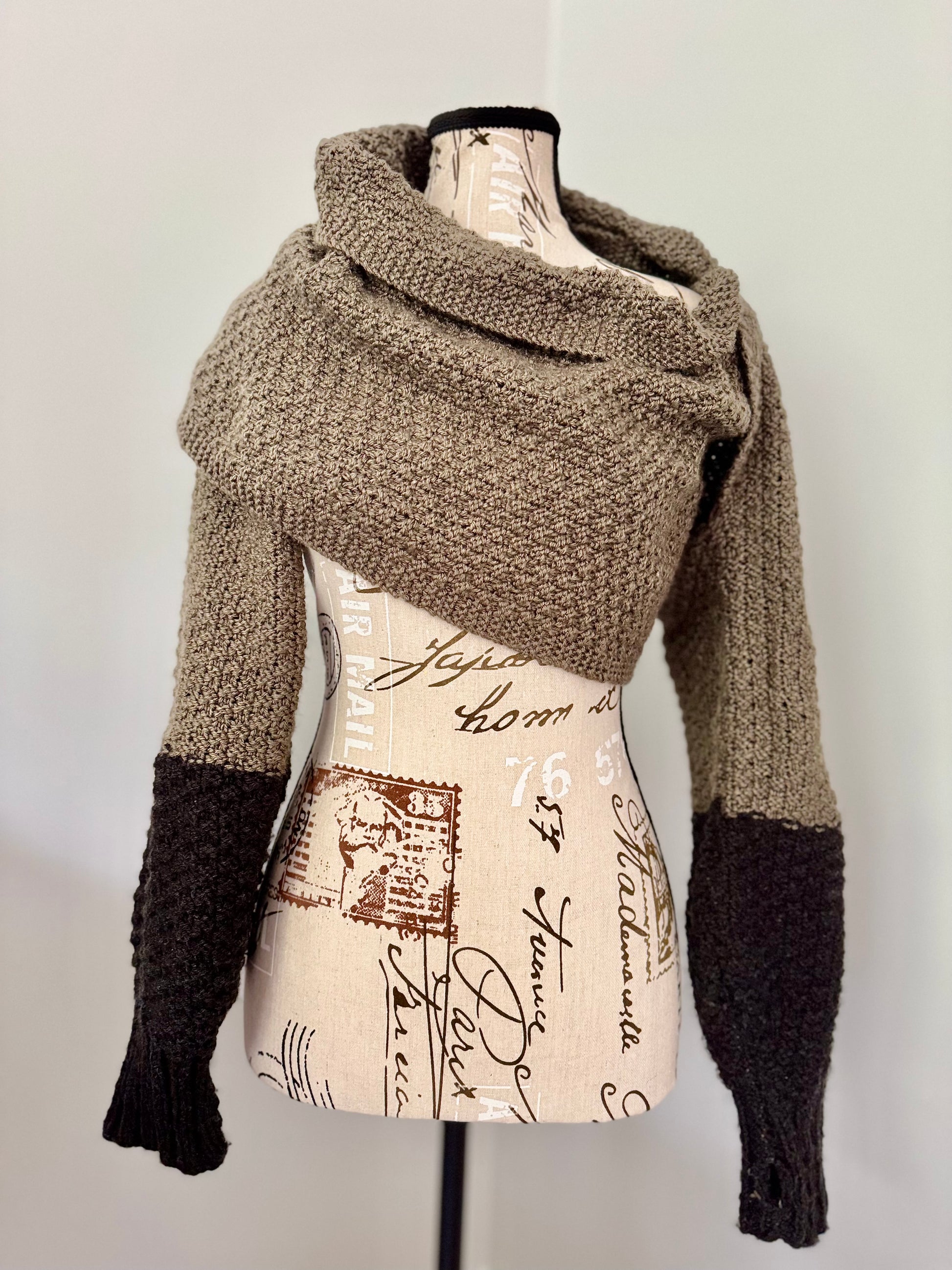 Hand knitted in double moss stitch this wrap envelopes like a hug and can be wrapped to your liking. Custom commission in a color of your choice with or without thumbholes. Can be made using worsted weight yarn for more drape or super bulky weight yarn for more structure.
