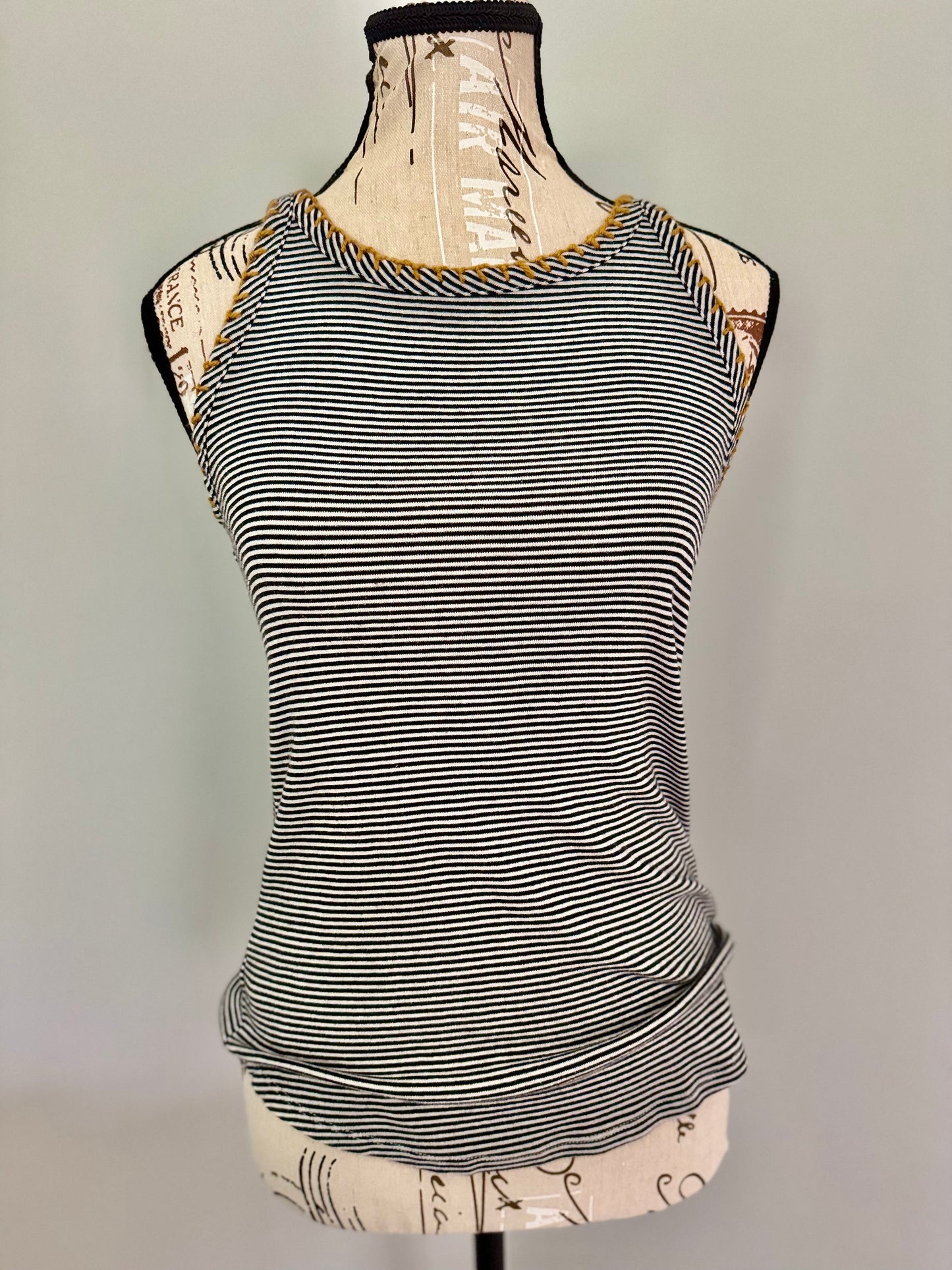 Upcycled fast fashion black and white striped tank top featuring gold hand stitched edging.