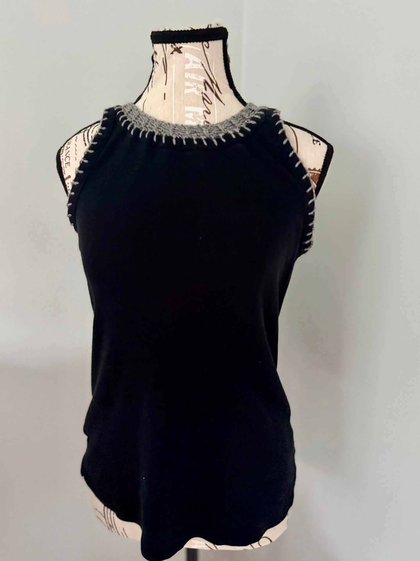 Upcycled fast fashion black tank top featuring silver gray hand stitched edging.