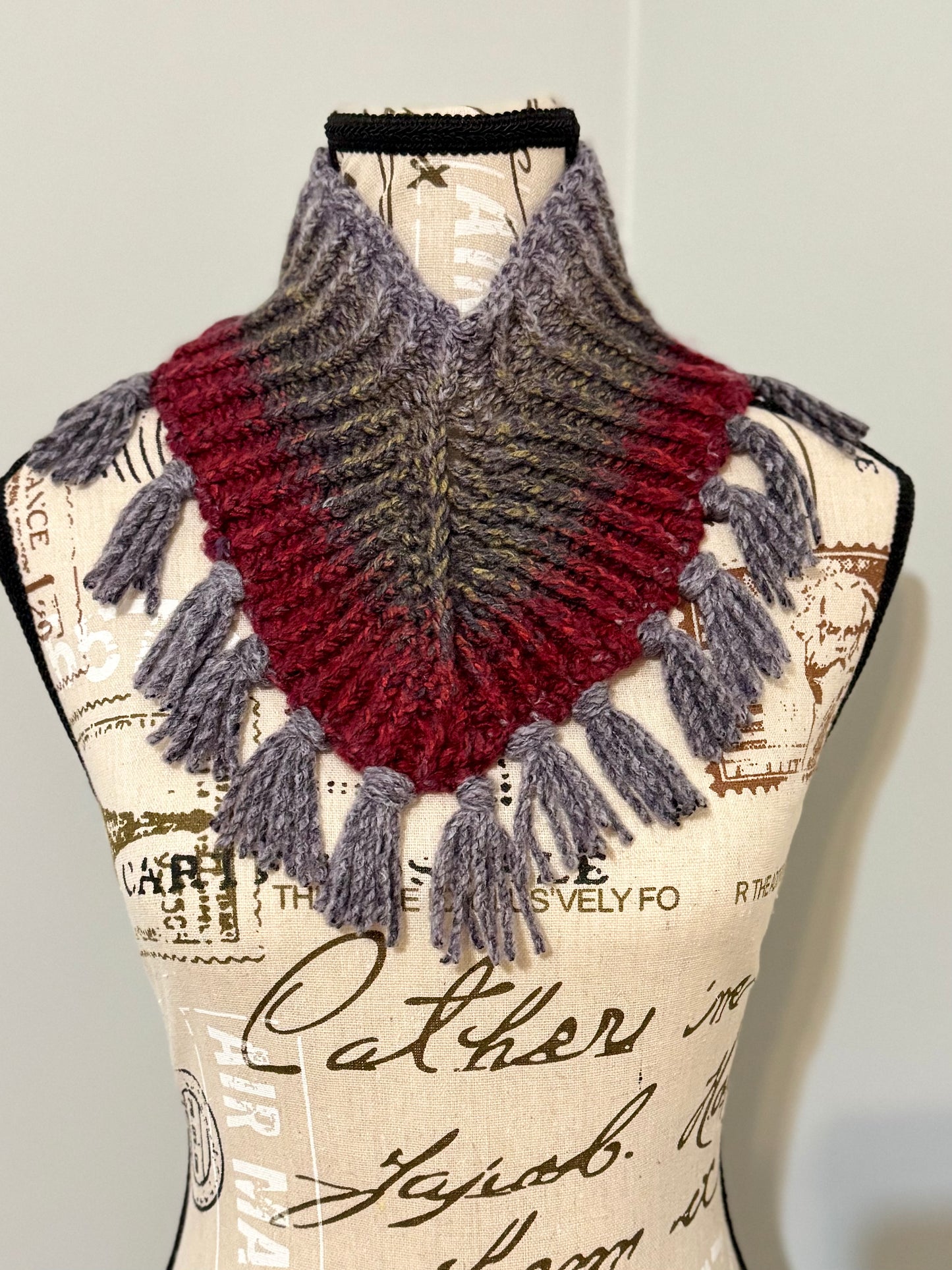 Hand knitted neck warmer in plum and gray featuring fringe tassles.