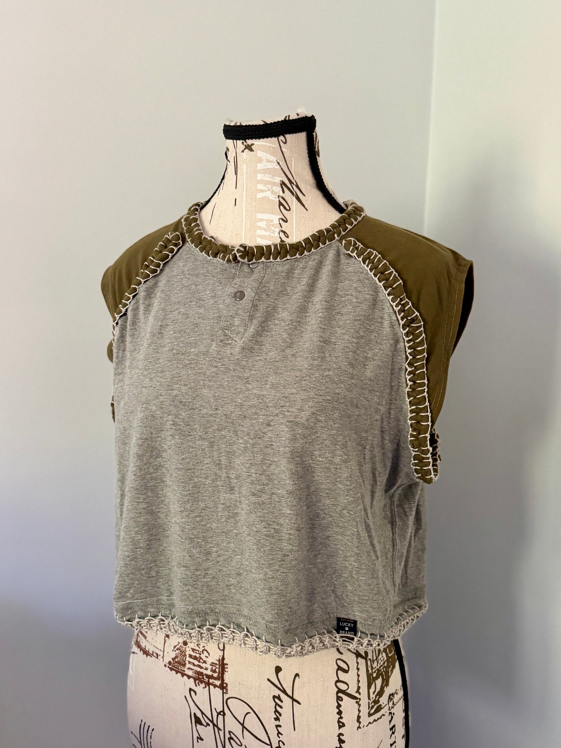 Upcycled and cropped gray and green raglan t-shirt featuring hand crochet and blanket stitch accents.