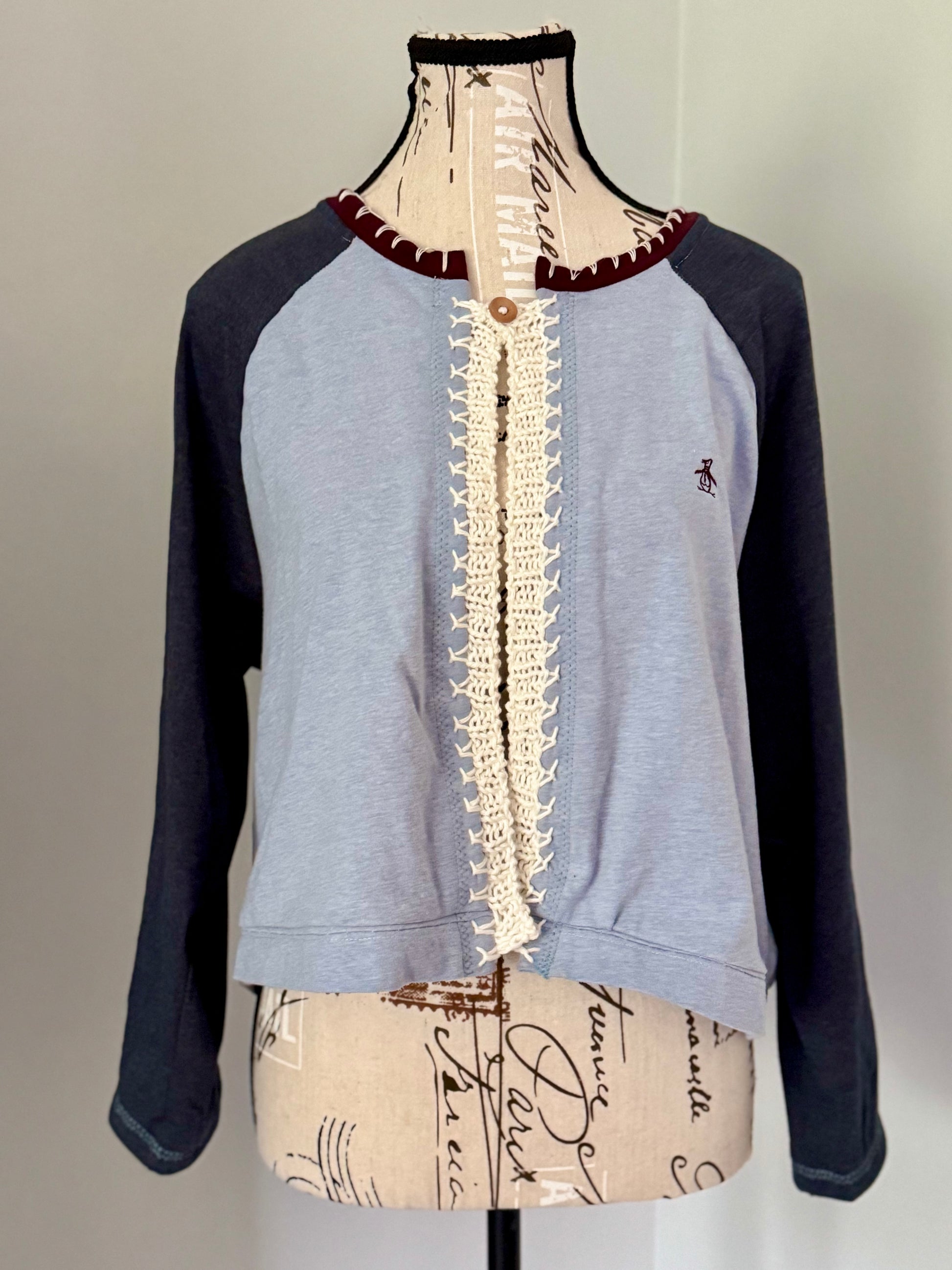 Upcycled blue raglan t-shirt trimmed with white hand knitted stitch work