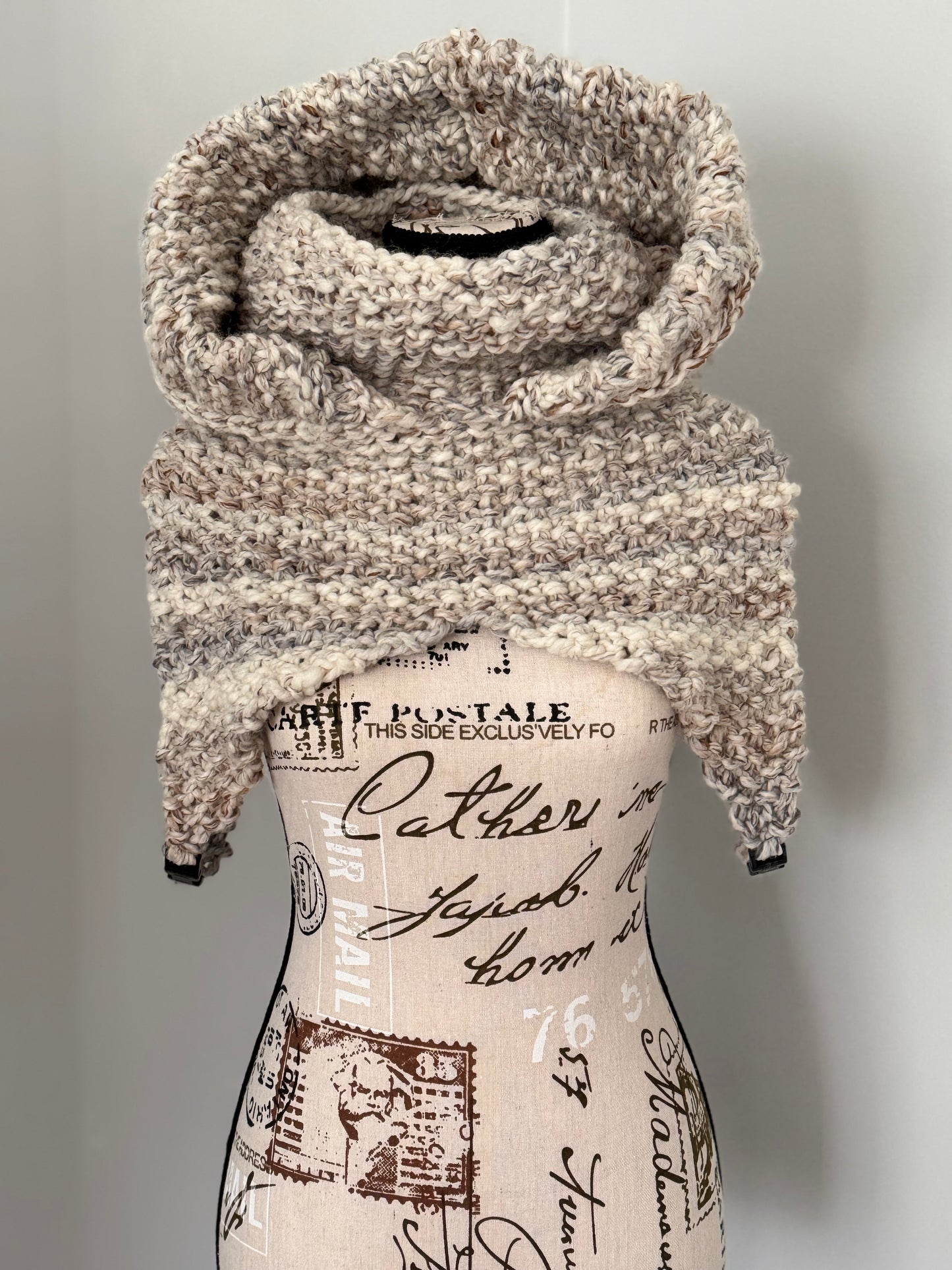 From the viral sensation this Matrix Cowl is hand knitted and features a generous hooded cowl neckline and under arm fasteners to be layered to your liking. Custom commission this piece in a color of your chosing and optionally add faux fur edging along the hood.